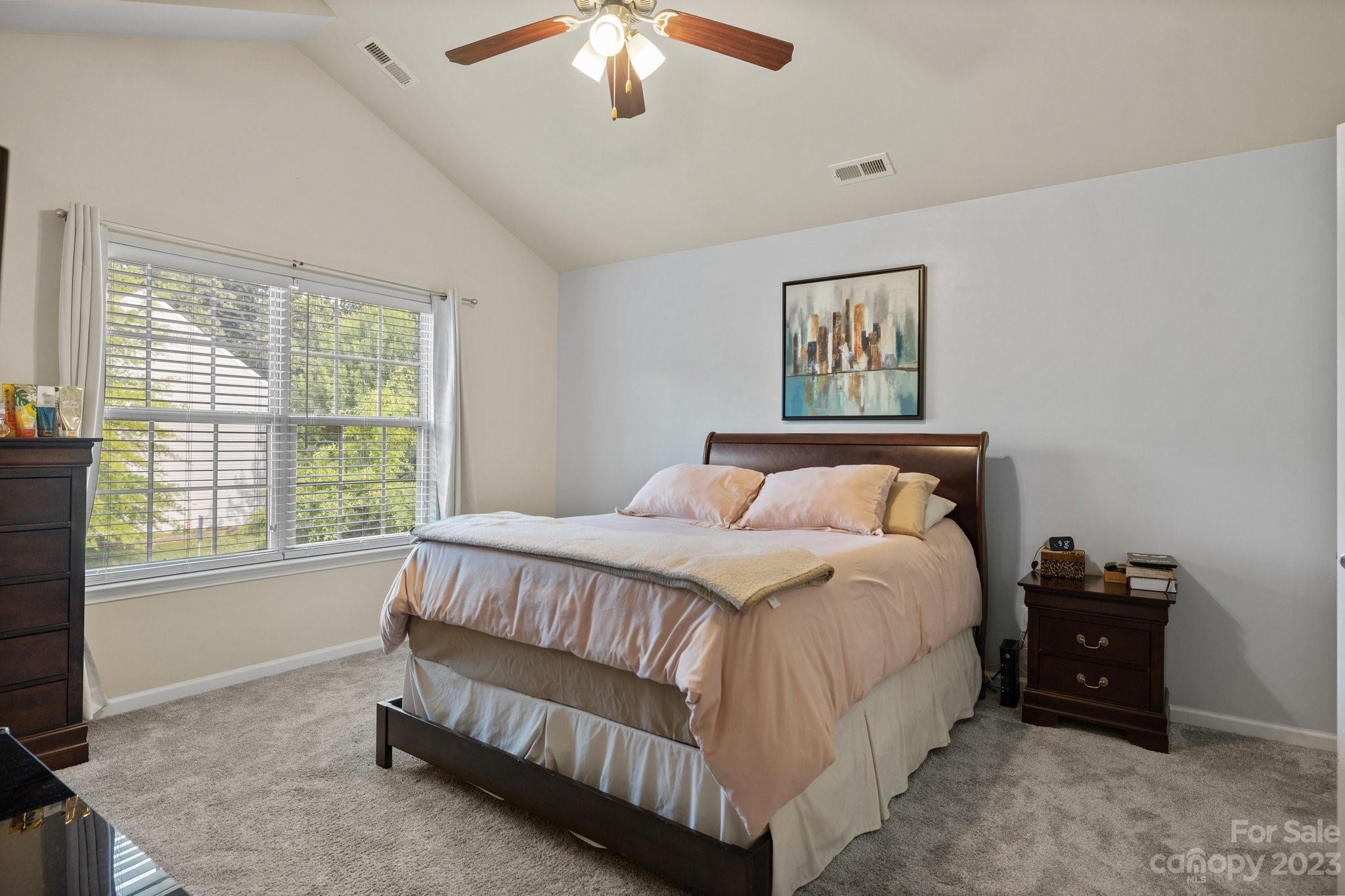 902 Rook Road Charlotte, NC 28216 - Photo 15 of 30 a bed sitting in a bedroom next to a window