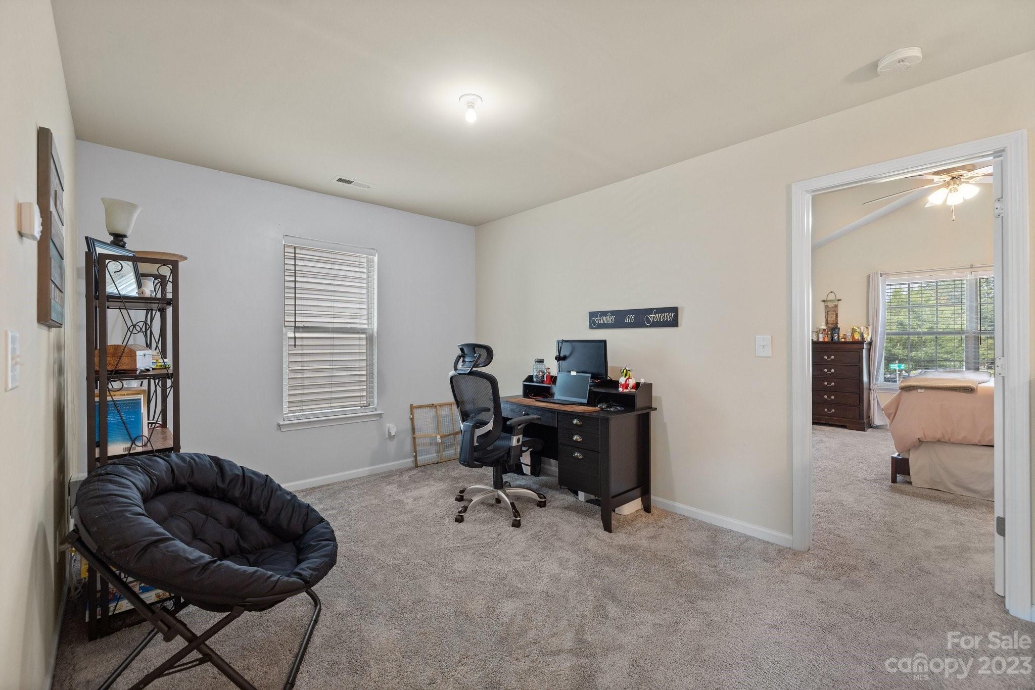 902 Rook Road Charlotte, NC 28216 - Photo 17 of 30 a livingroom with workspace and a window