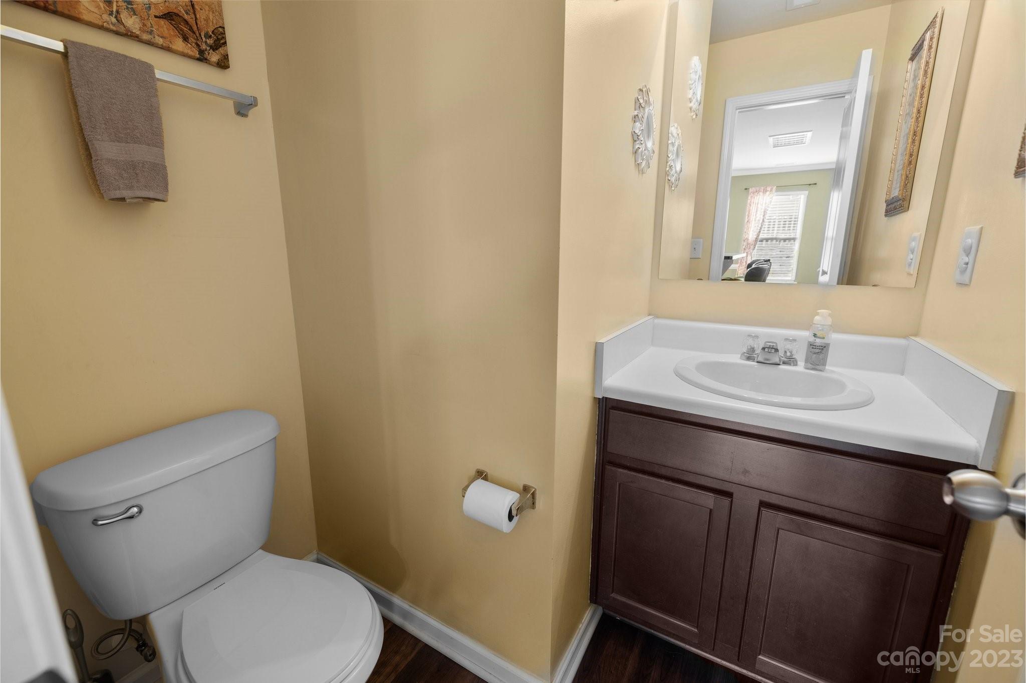 902 Rook Road Charlotte, NC 28216 - Photo 23 of 30 a bathroom with a sink a toilet and mirror