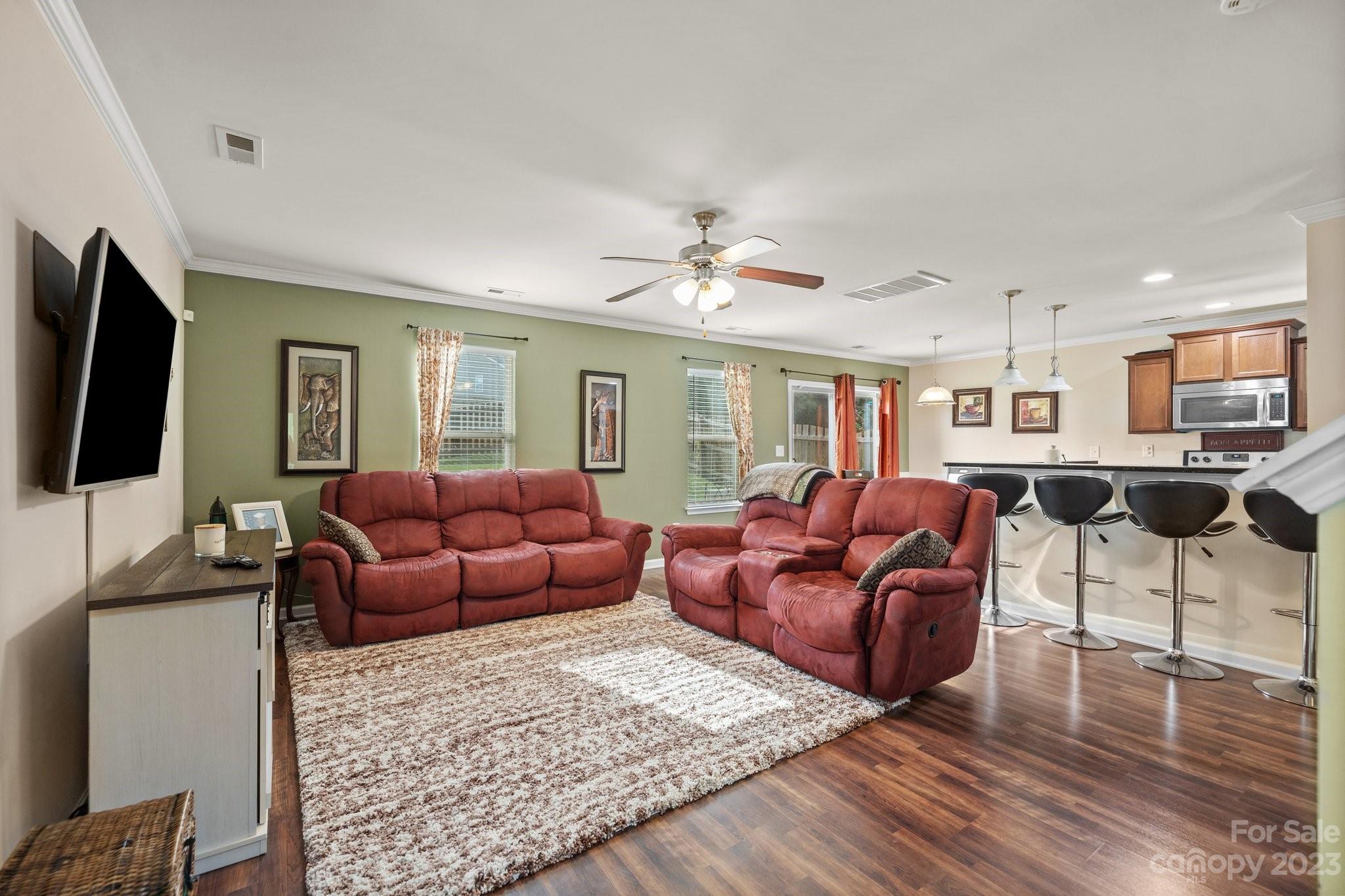 902 Rook Road Charlotte, NC 28216 - Photo 3 of 30 a living room with furniture and a flat screen tv