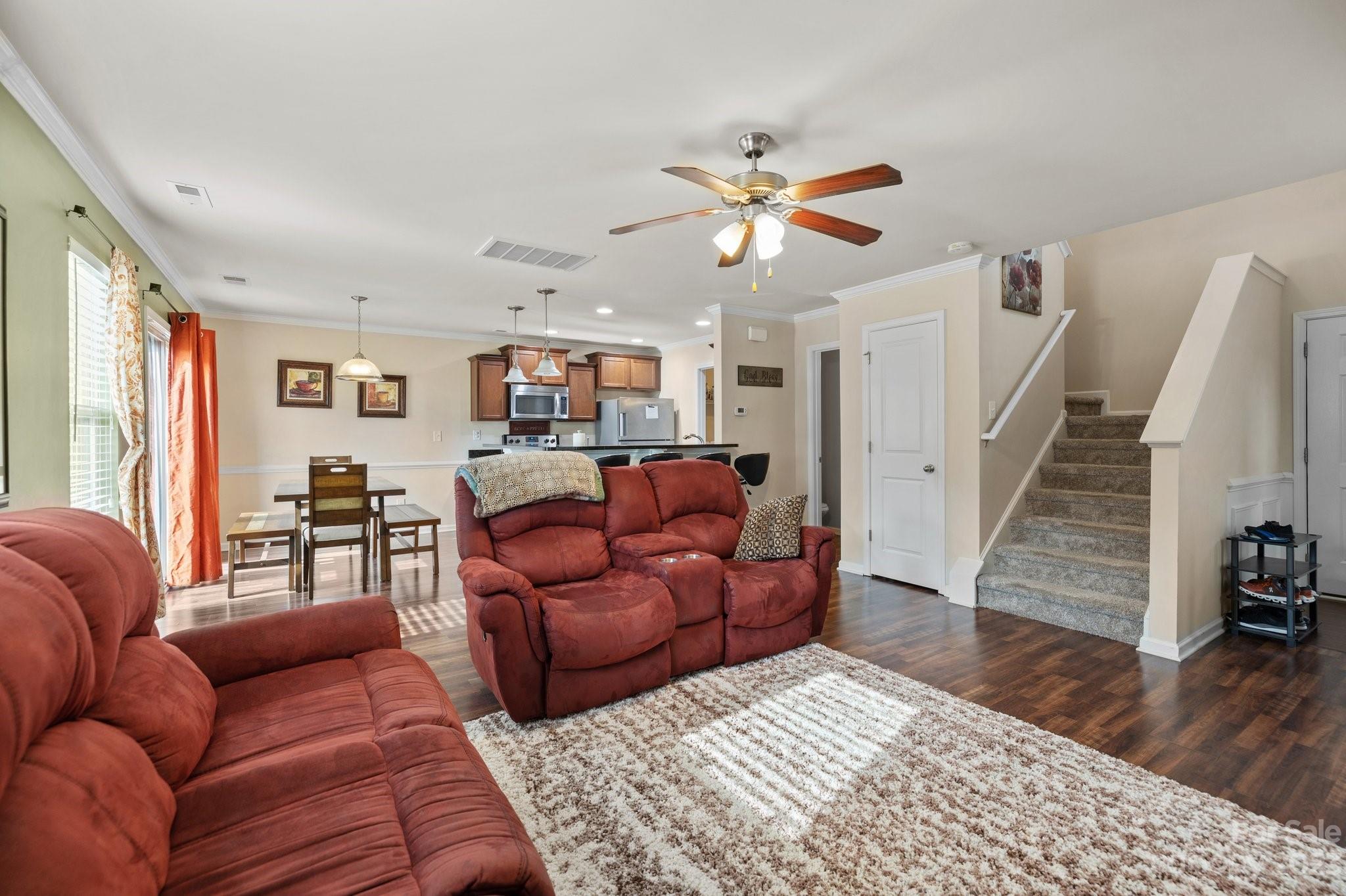 902 Rook Road Charlotte, NC 28216 - Photo 4 of 30 a living room with furniture and a wooden floor