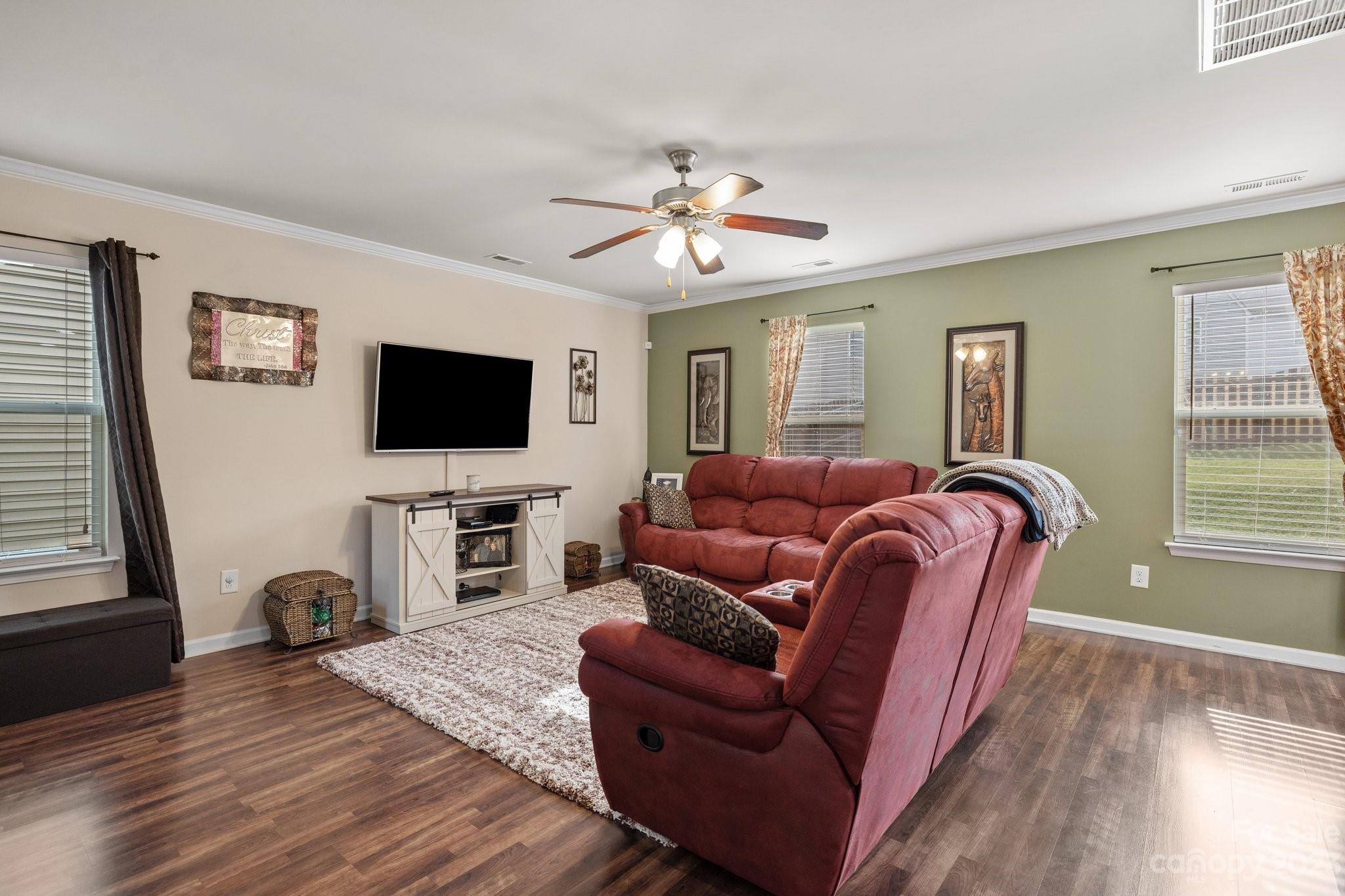 902 Rook Road Charlotte, NC 28216 - Photo 5 of 30 a living room with furniture and a flat screen tv