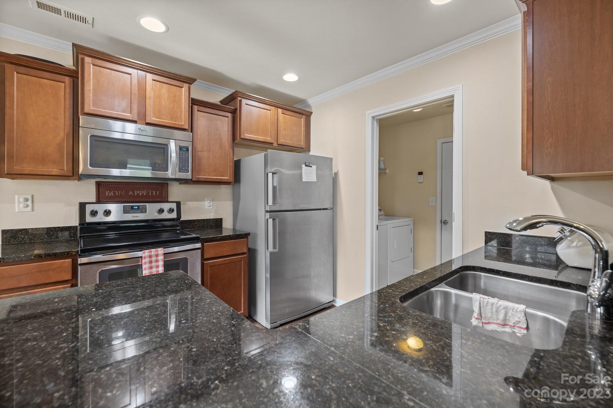 902 Rook Road Charlotte, NC 28216 - Photo 8 of 30 a kitchen with a refrigerator sink and stove