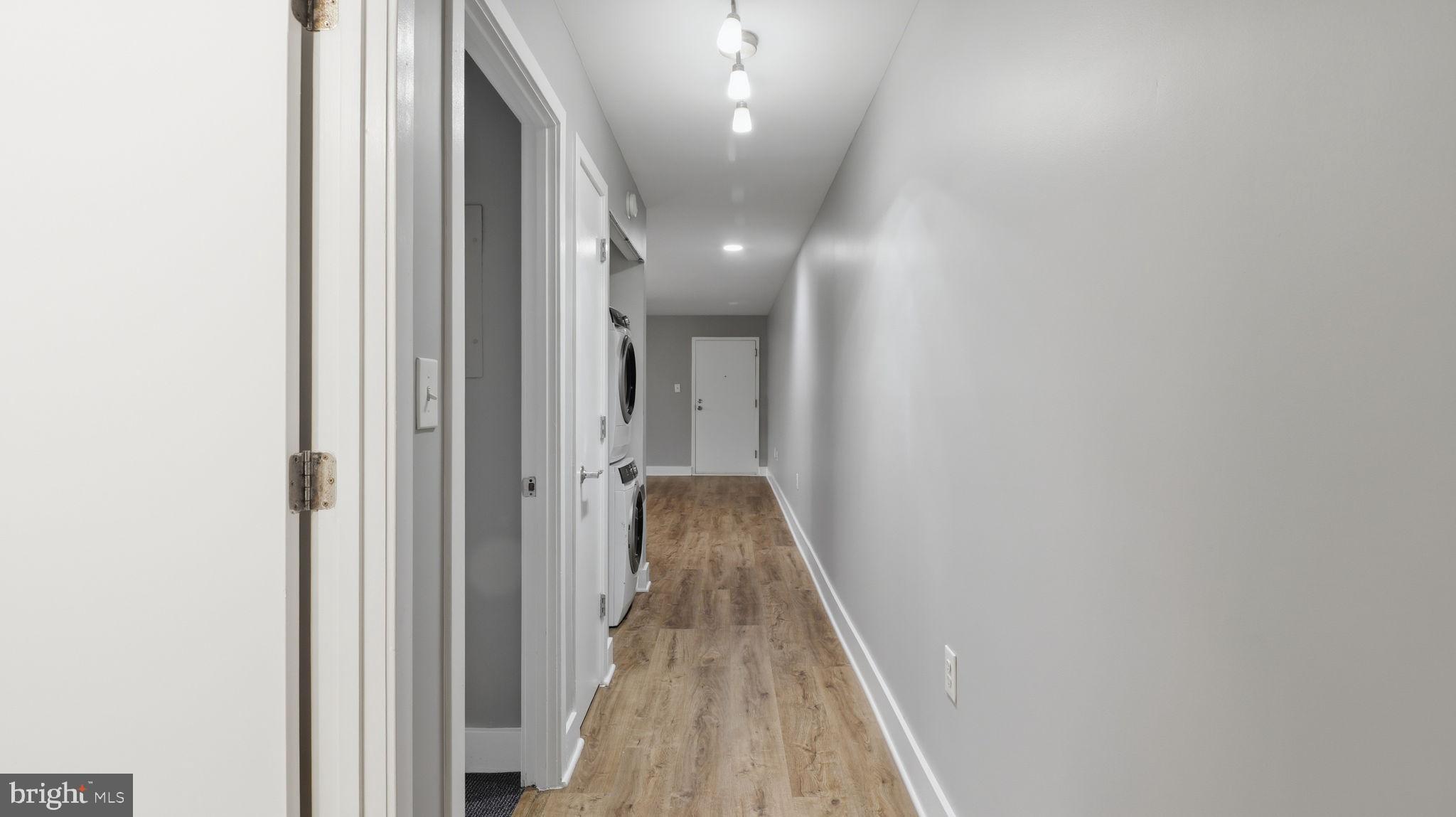 2317 16th Street Southeast, Unit 102 Washington, DC 20020 - Photo 17 of 23 a view of a hallway with wooden floor