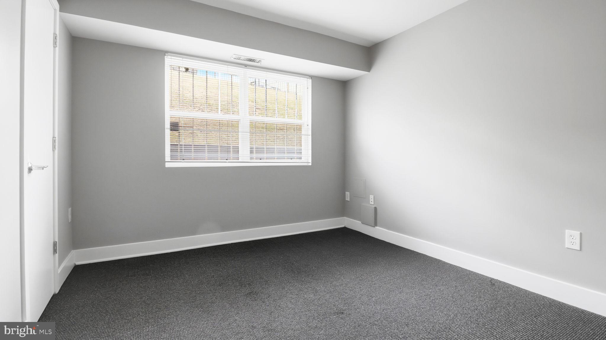 2317 16th Street Southeast, Unit 102 Washington, DC 20020 - Photo 19 of 23 an empty room with a window