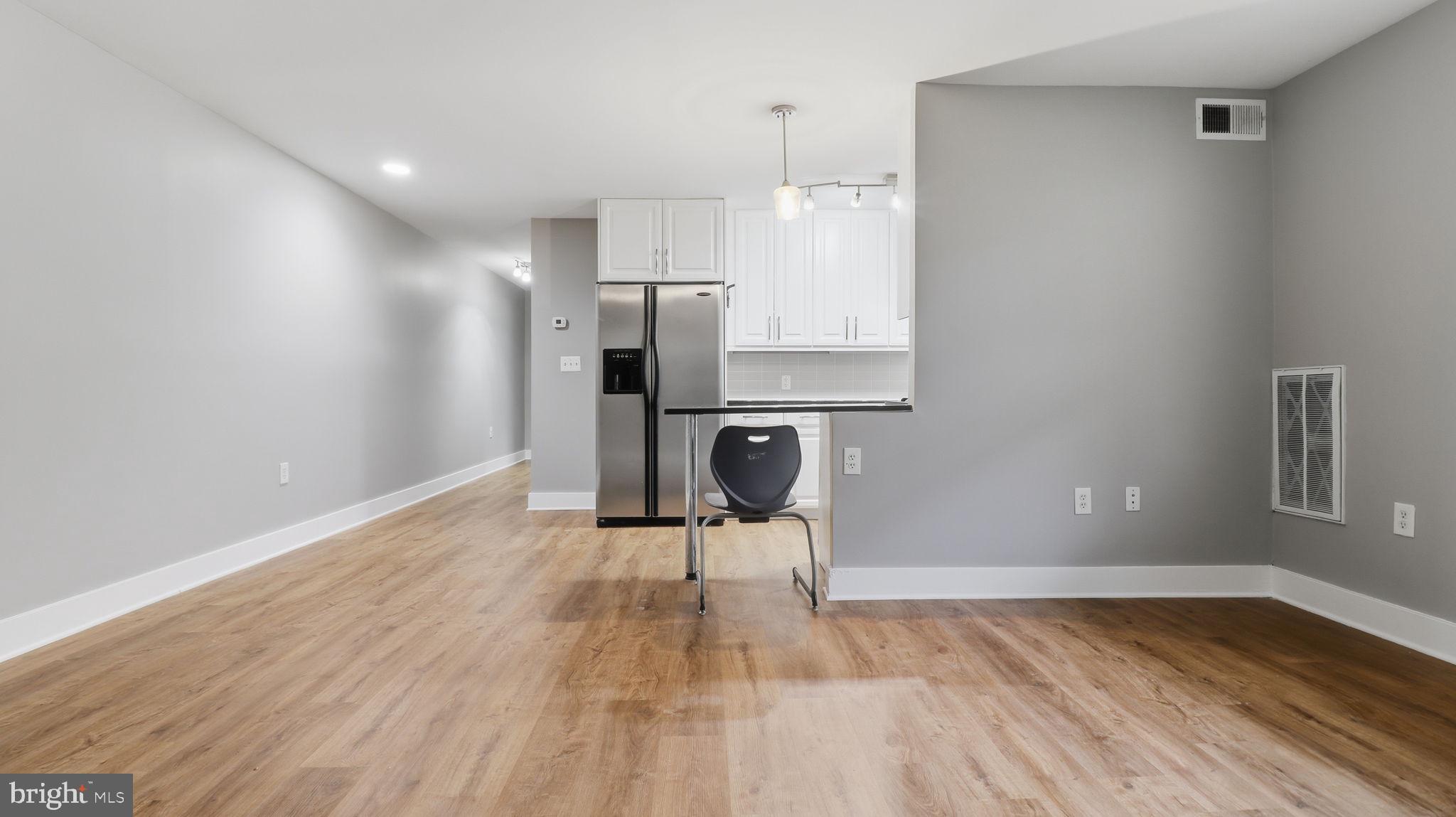 2317 16th Street Southeast, Unit 102 Washington, DC 20020 - Photo 2 of 23 a view of empty room with wooden floor