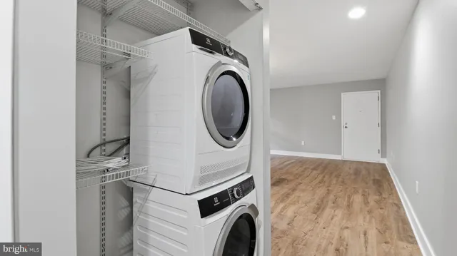 a view of a storage & utility room with dryer and washer