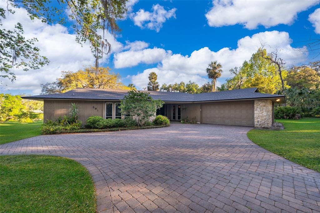 381 Maple Court Oviedo, FL 32765 - Photo 1 of 1 a view of a house with a yard and a garden