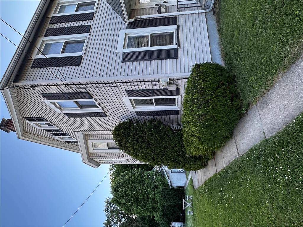 5128 3rd Street Whitehall, PA 18052 - Photo 3 of 26 Well-maintained siding and neatly trimmed shrubbery enhance this home's inviting curb appeal.