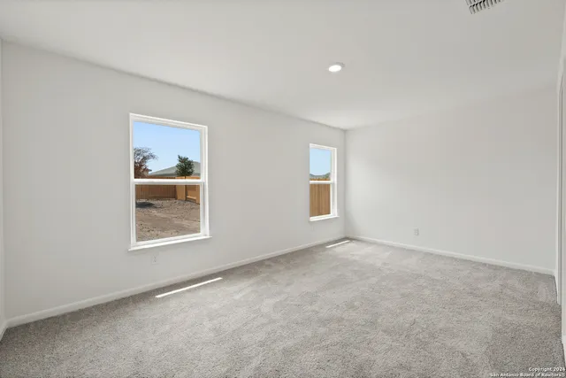 an empty room with windows