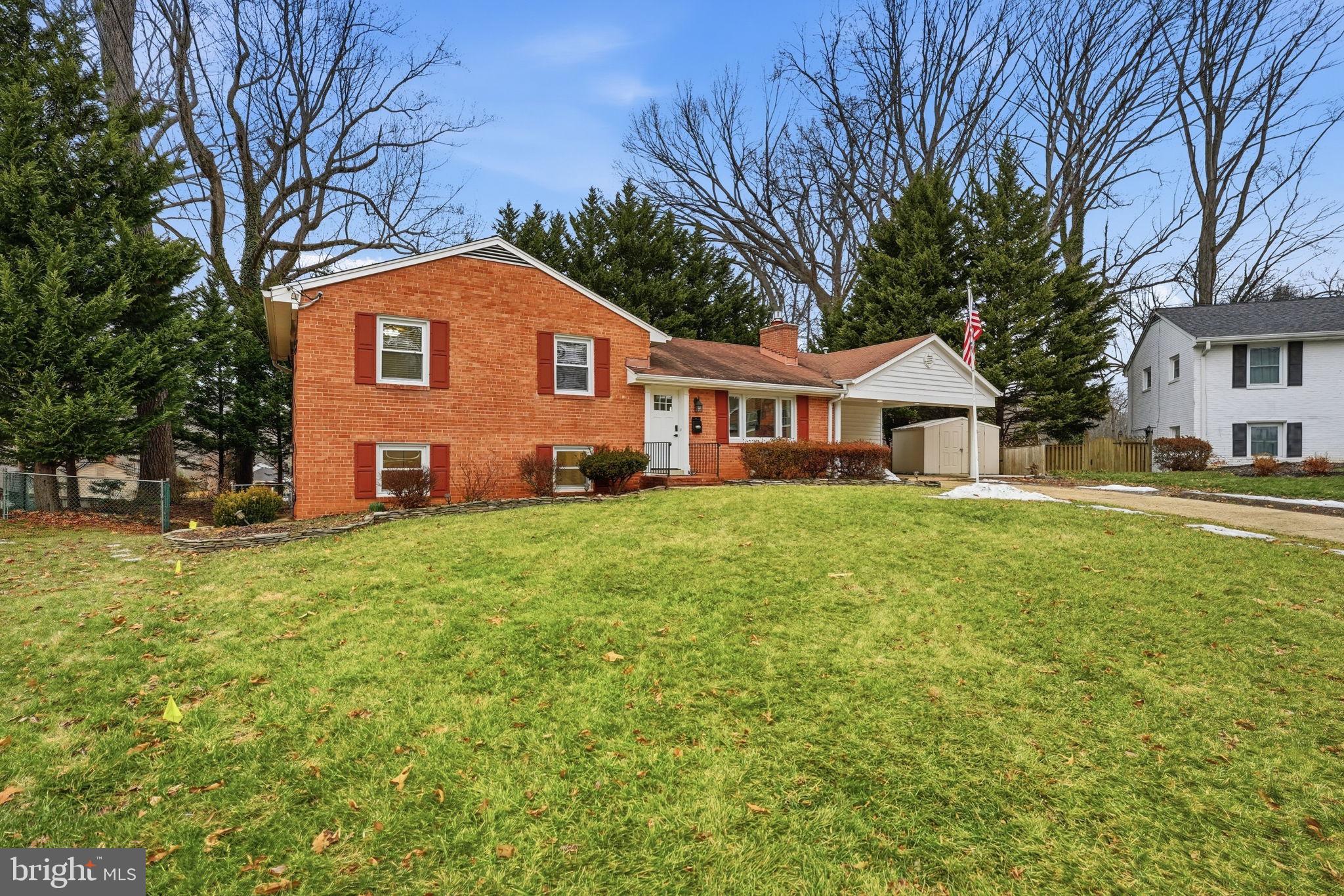 5718 Anola Court Springfield, VA 22151 - Photo 1 of 45 a front view of a house with a yard and trees