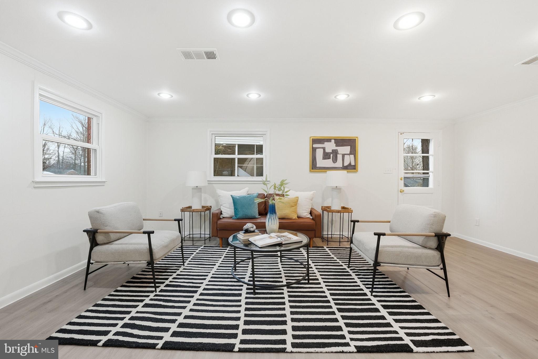 5718 Anola Court Springfield, VA 22151 - Photo 2 of 45 a living room with furniture and a rug