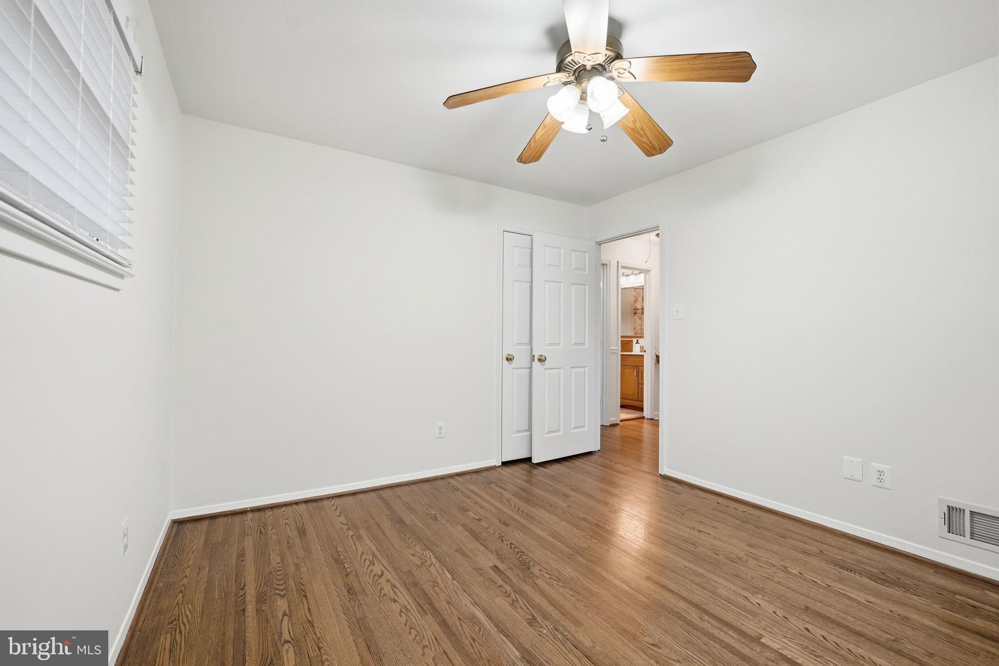 5718 Anola Court Springfield, VA 22151 - Photo 28 of 45 wooden floor in an empty room with a window
