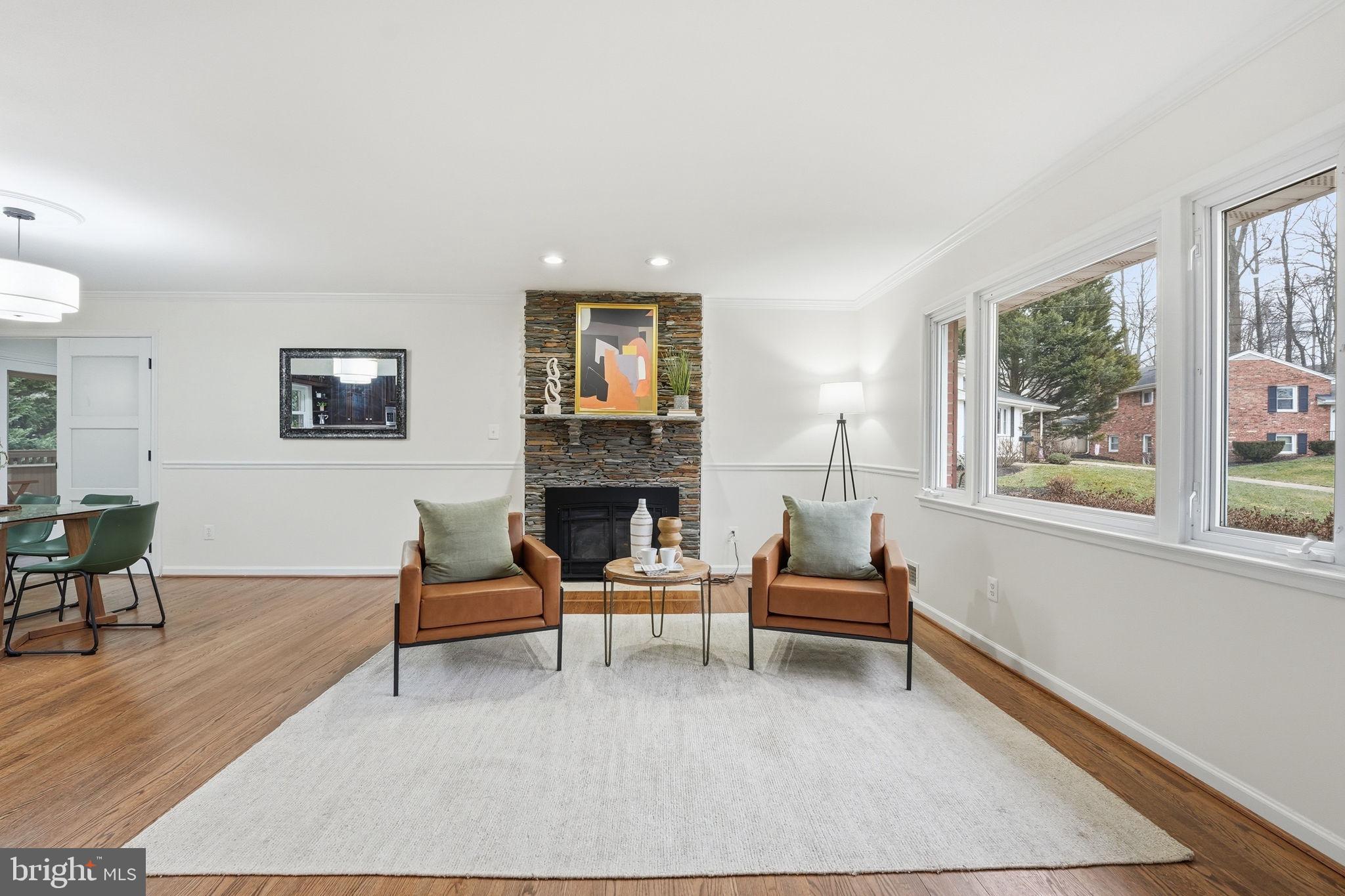 5718 Anola Court Springfield, VA 22151 - Photo 5 of 45 a living room with furniture and a fireplace