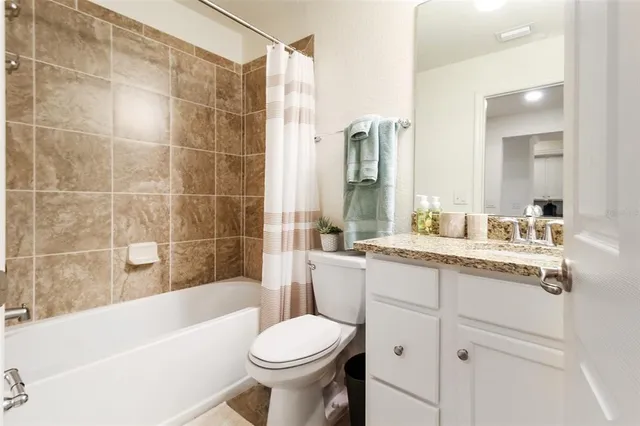 a bath tub sitting next to a white sink