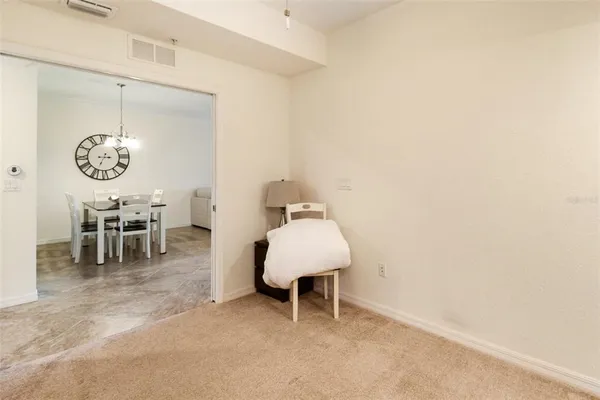 a living room with furniture a window and a chandelier