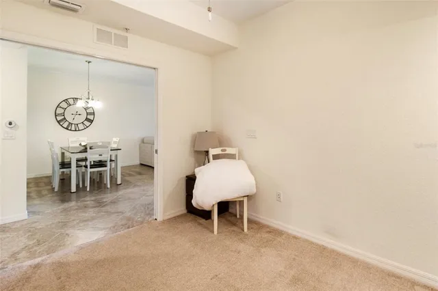 a living room with furniture a window and a chandelier