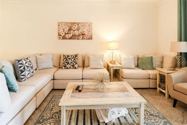 a living room with furniture and a rug