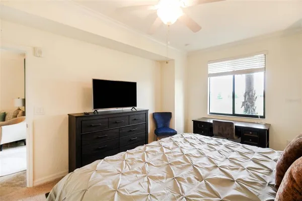 a bedroom with a bed and a cabinets