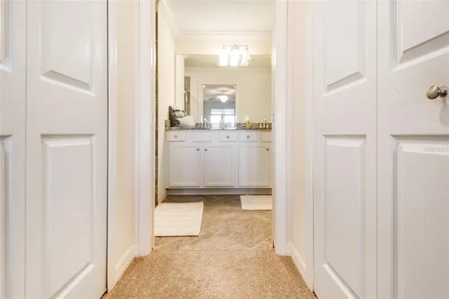 a bathroom with a granite countertop sink mirror and toilet
