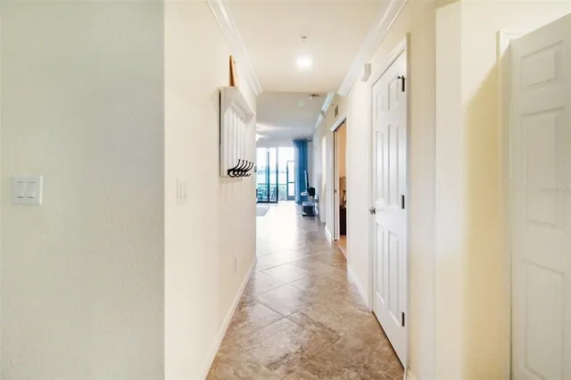 a view of a hallway with a wooden floor