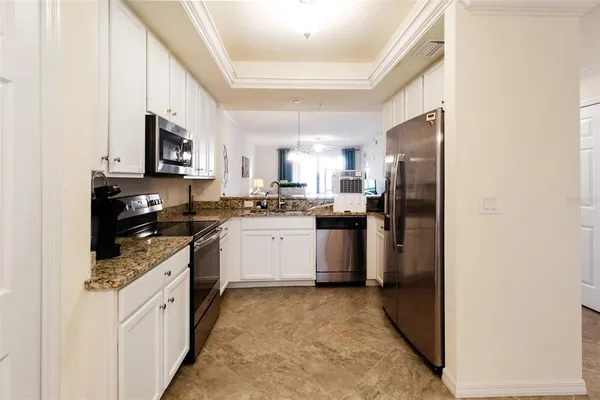 a kitchen with a sink stove and refrigerator