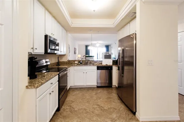 a kitchen with a sink stove and refrigerator