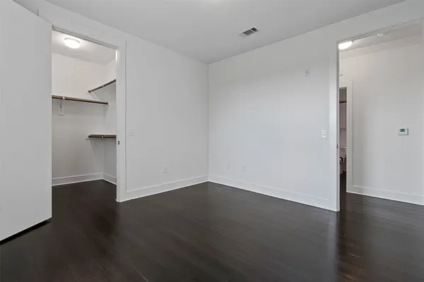 an empty room with wooden floor