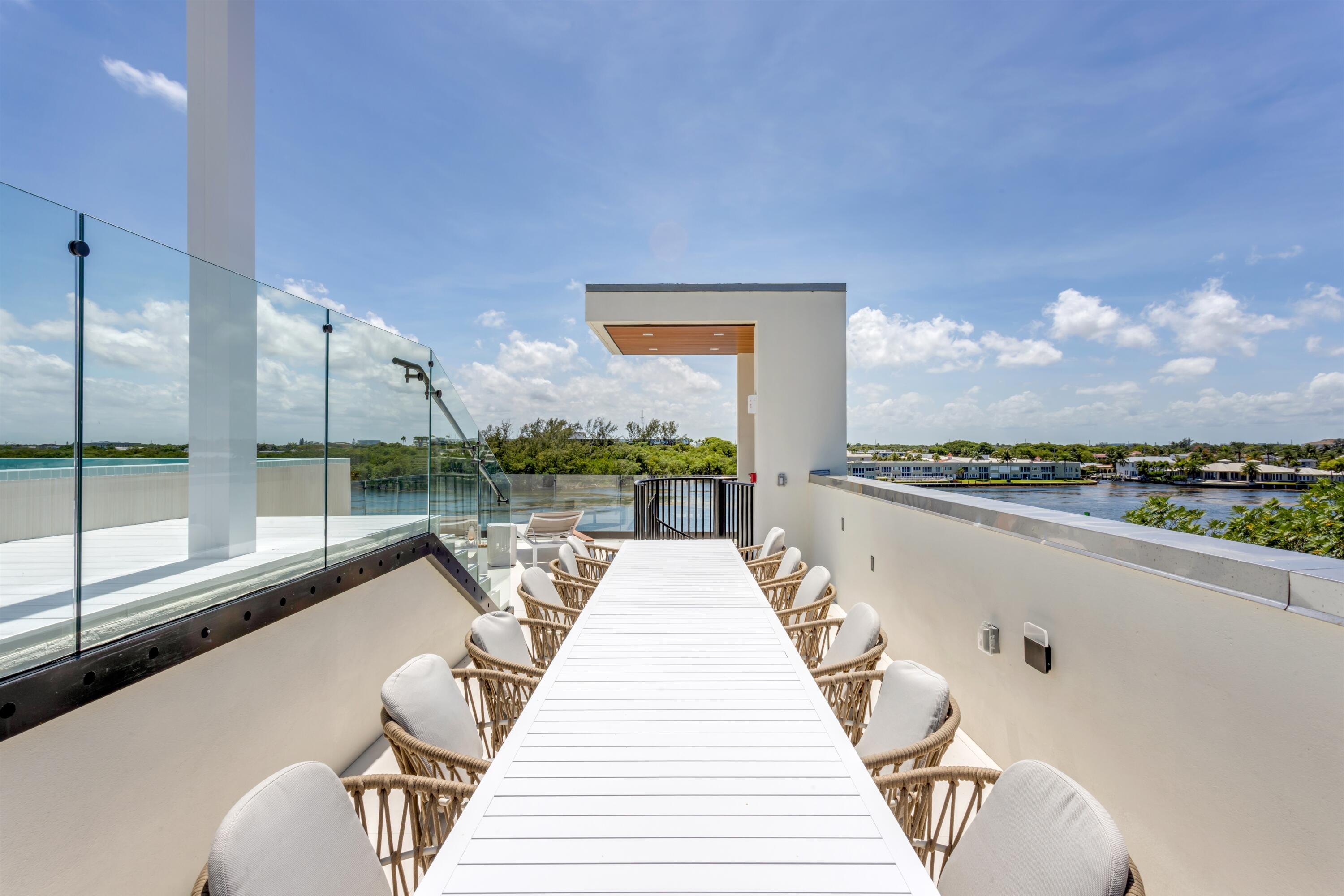 900 Lago Mar Lane, Unit PH Boca Raton, FL 33431 - Photo 39 of 58 a view of a balcony with chairs