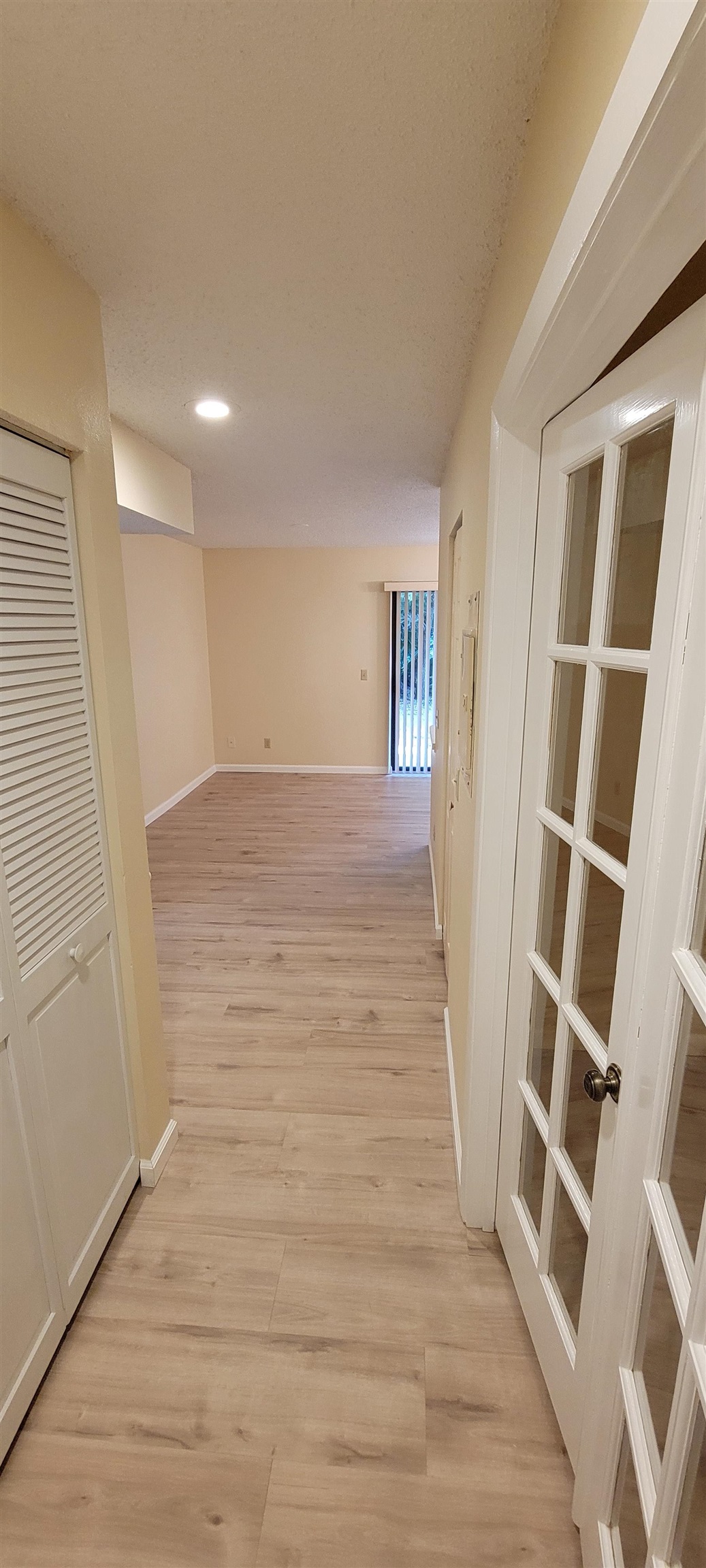 5 Catalonia Court St. Augustine, FL 32086 - Photo 12 of 30 Corridor with light wood finished floors, recessed lighting, and a textured ceiling