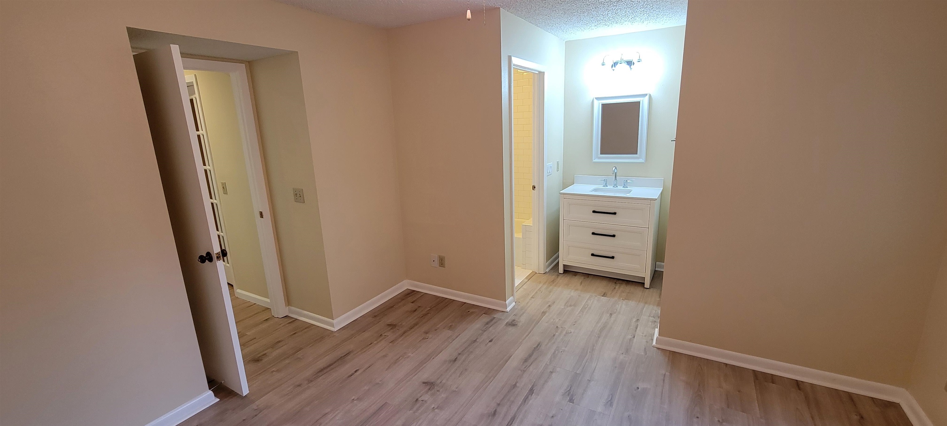 5 Catalonia Court St. Augustine, FL 32086 - Photo 17 of 30 Hall with light wood finished floors and a textured ceiling