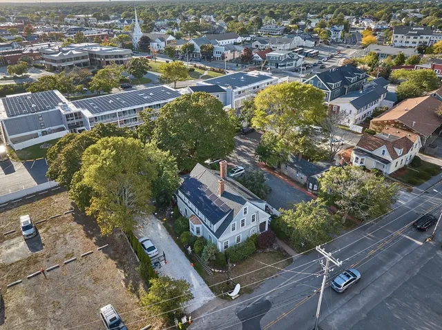 an aerial view of residential houses with outdoor space