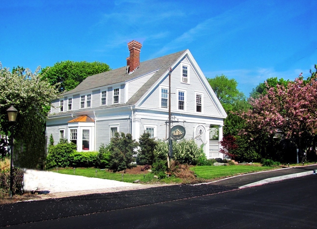 35 Pleasant Street Barnstable, MA 02601 - Photo 5 of 6 a front view of a house with a yard