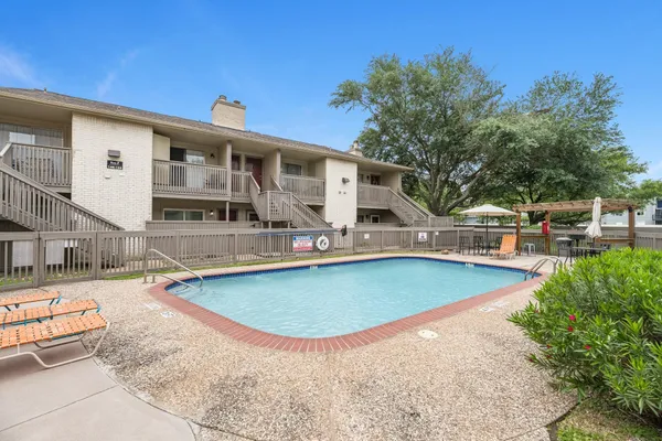 swimming pool view with a outdoor seating