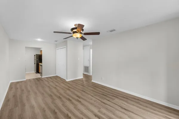 a view of an empty room with a window