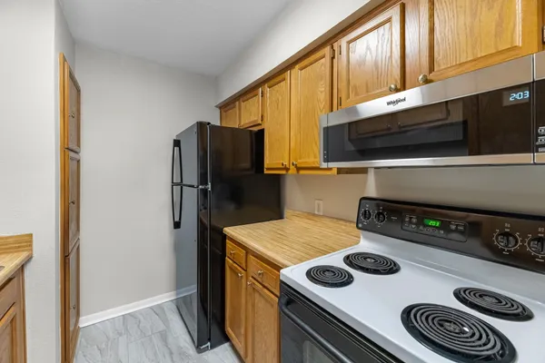 a kitchen with a stove and a microwave