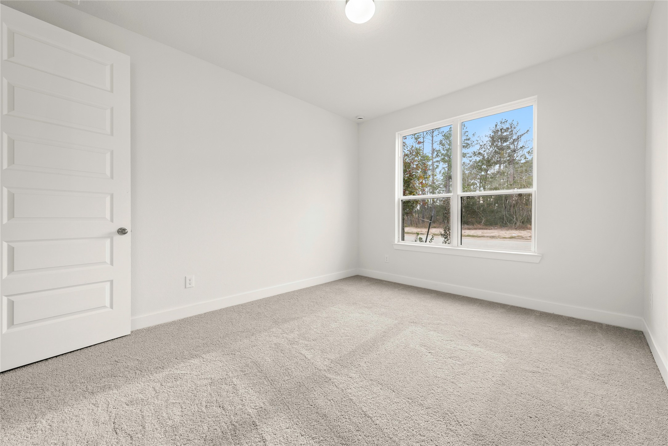 18917 Moonriver Street Conroe, TX 77302 - Photo 14 of 28 an empty room with a window