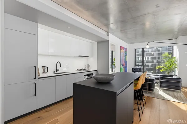 a kitchen with a sink and a stove top oven