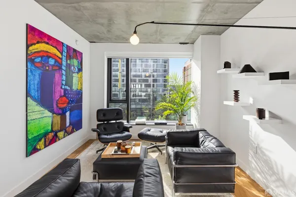 a living room with furniture and a window