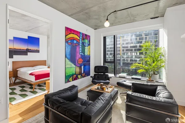 a bedroom that has a bed and a table in it