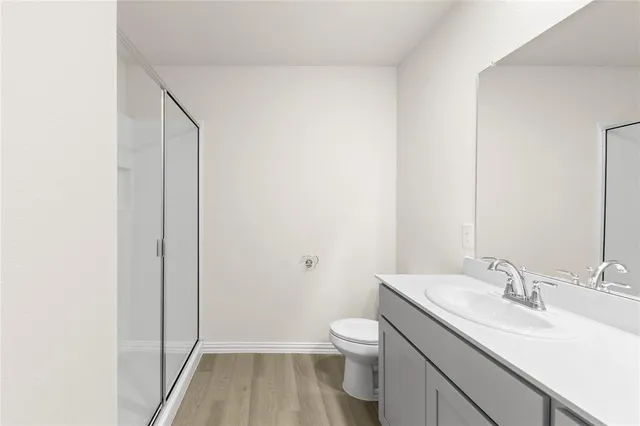 a bathroom with 2 sink and a mirror