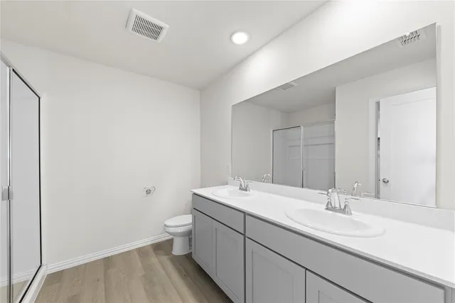 a bathroom with a sink toilet and vanity