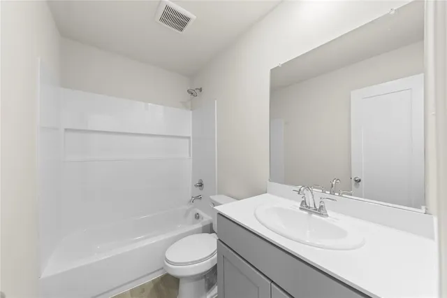 a view of an empty room and a window