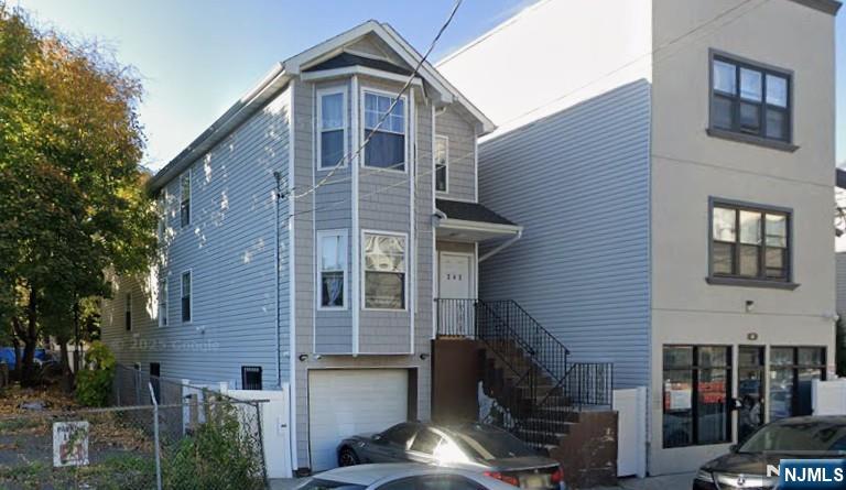 242 Rosa Parks Boulevard Paterson, NJ 07501 - Photo 6 of 6 a front view of a building with glass windows
