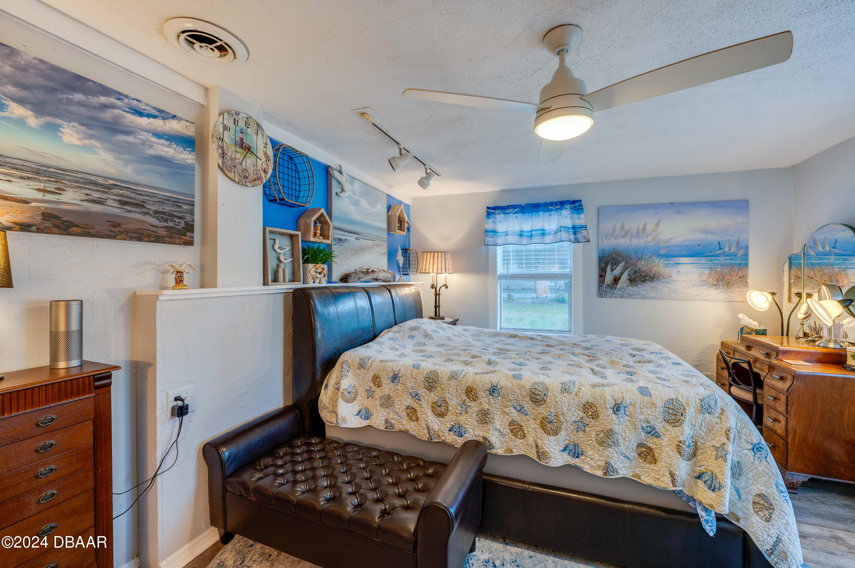 4850 Spruce Creek Road Port Orange, FL 32127 - Photo 10 of 27 a bedroom with a bed dresser and a window