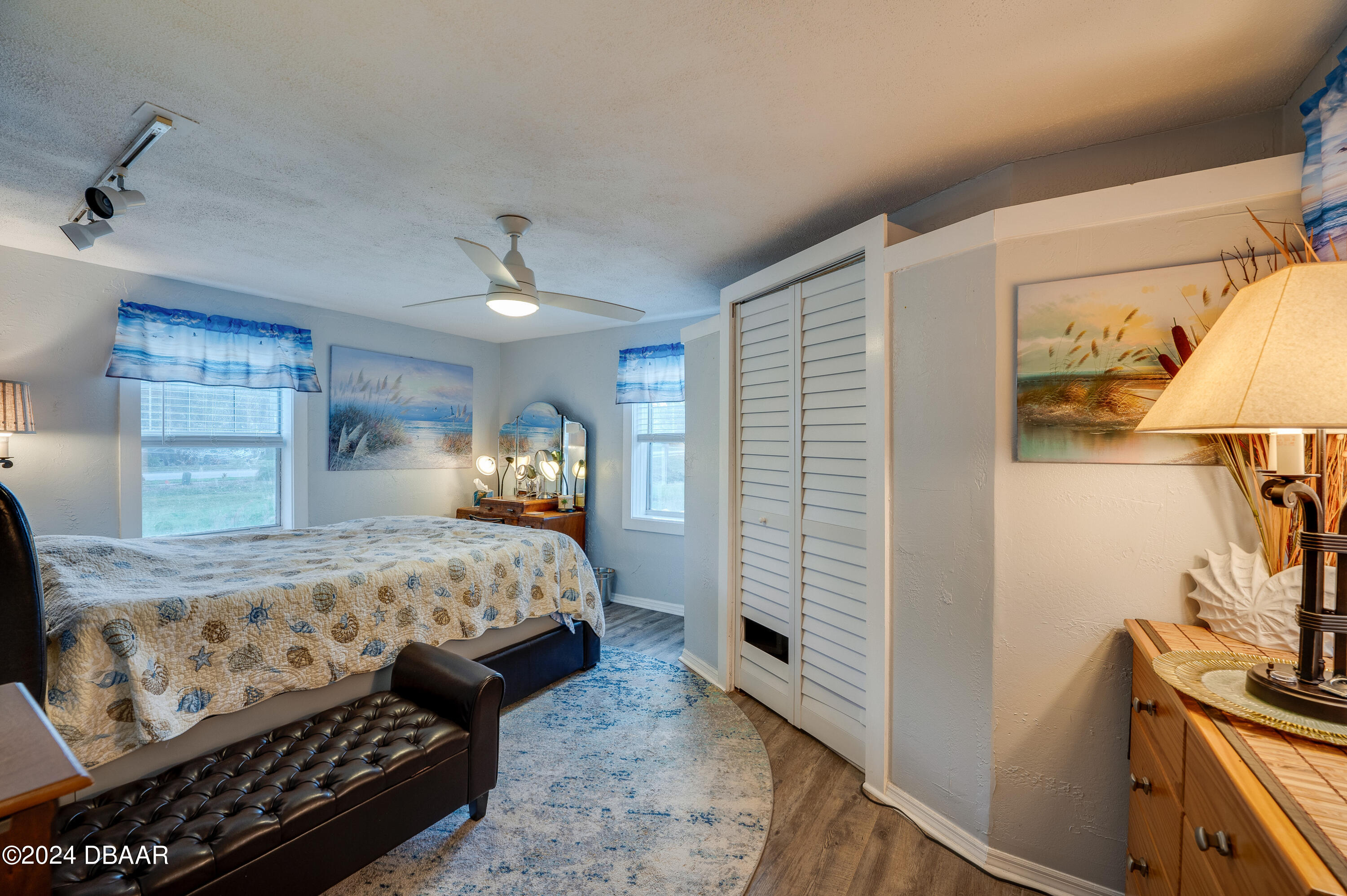 4850 Spruce Creek Road Port Orange, FL 32127 - Photo 11 of 27 a bedroom with a bed and a flat tv screen on dresser