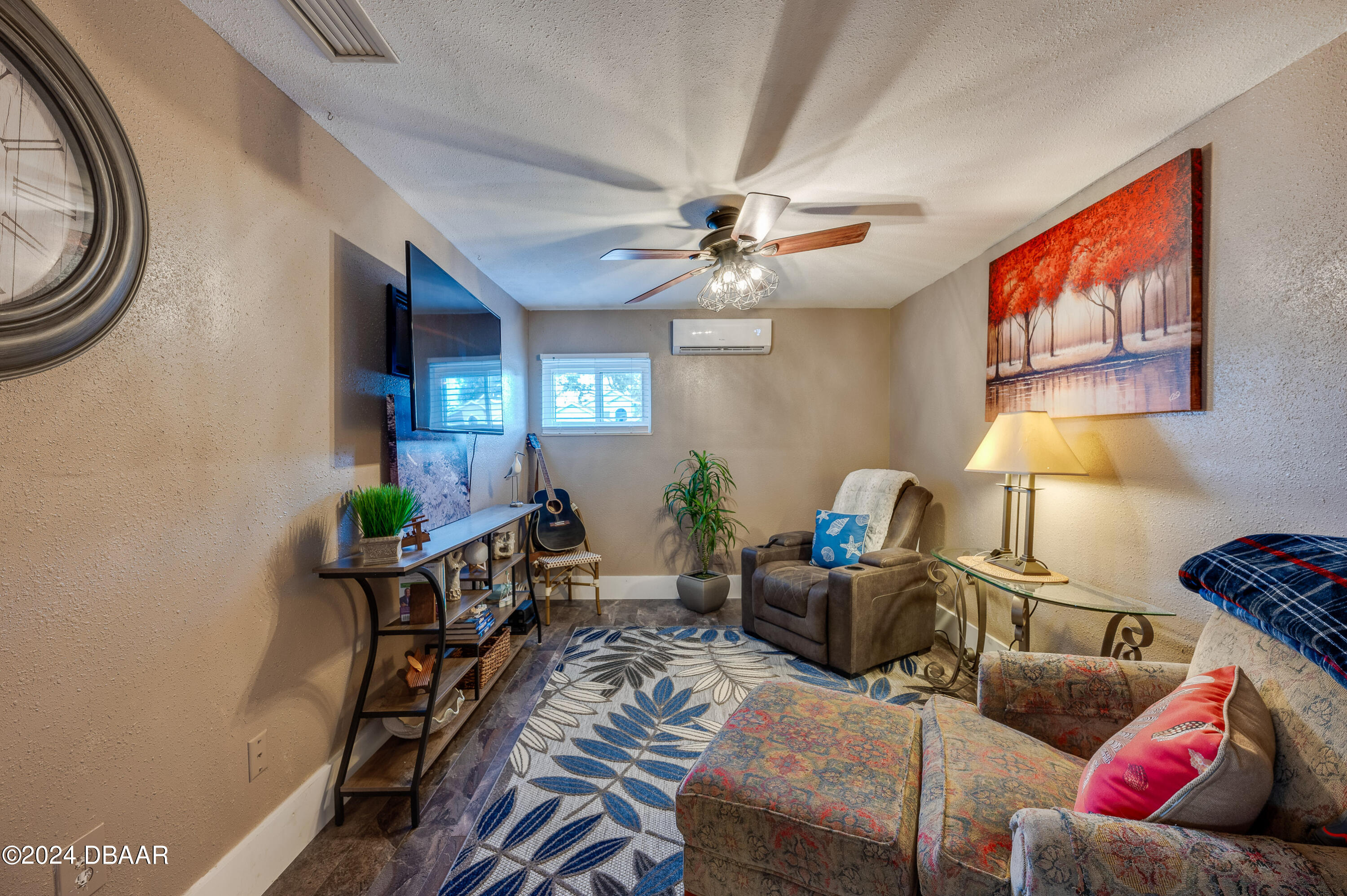 4850 Spruce Creek Road Port Orange, FL 32127 - Photo 17 of 27 a living room with furniture a chandelier and a window
