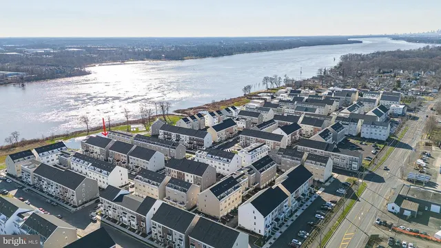 an aerial view of residential building and ocean view