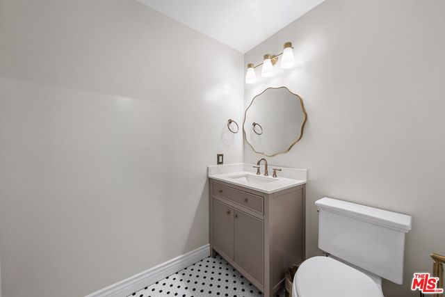 a bathroom with a toilet and a sink