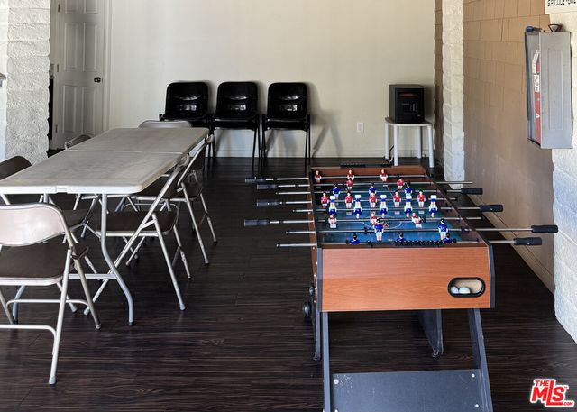 a kitchen with stainless steel appliances granite countertop a refrigerator and a stove